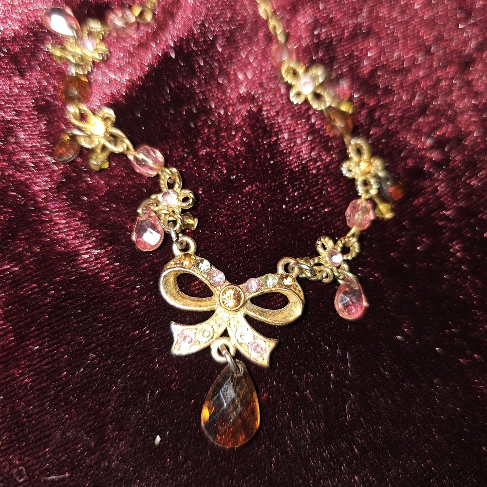 Elegant Gold and Pink Bow Necklace
